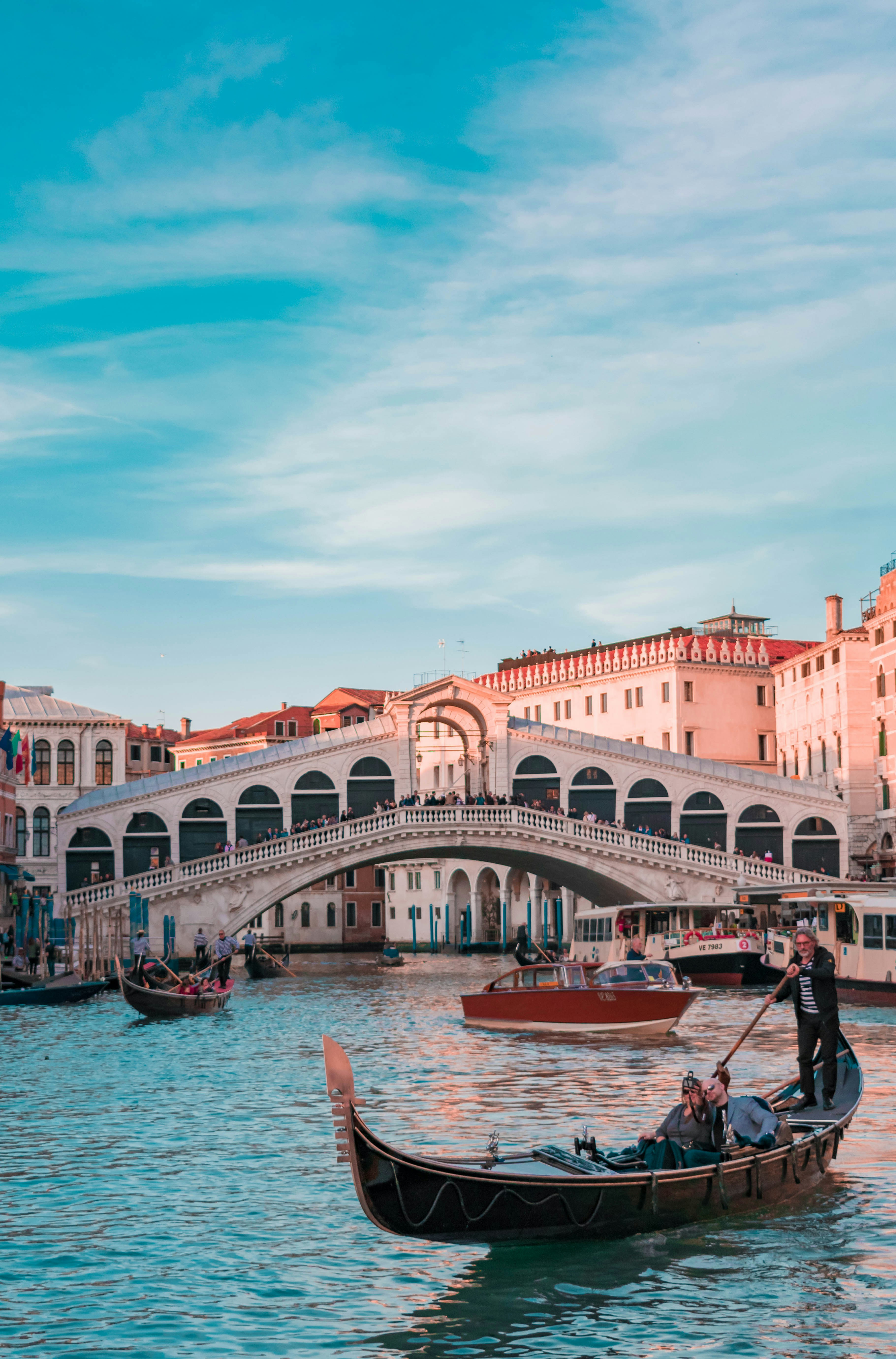 Classic striped beach cabins and grand Art Nouveau architecture at Venice Lido.