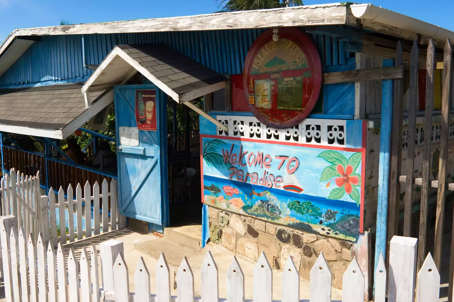 The colorful exterior of the Island Paradise Restaurant in Mayreau village