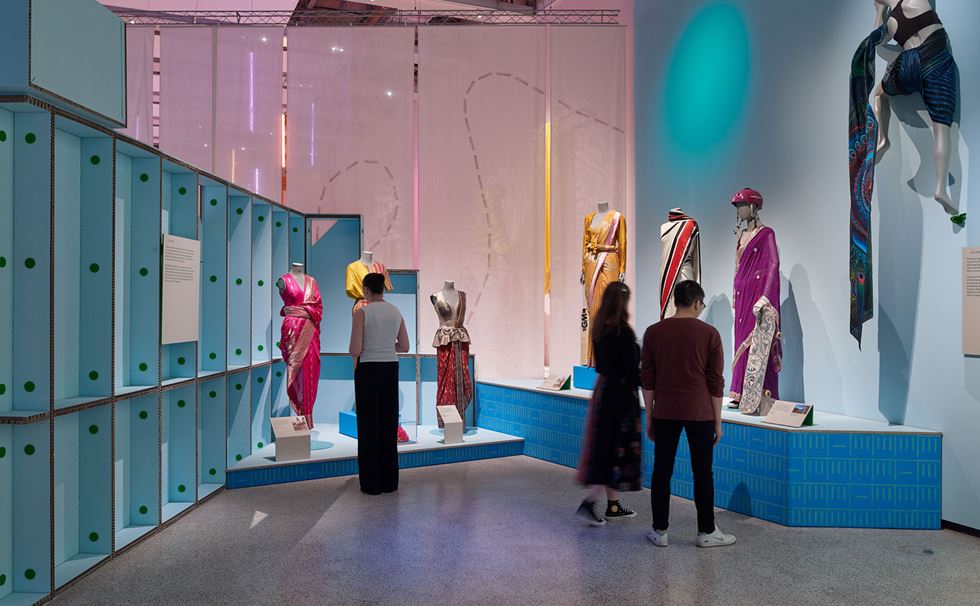 A gallery view of 'The Offbeat Sari' exhibition featuring various drapes on mannequins at the Design Museum.