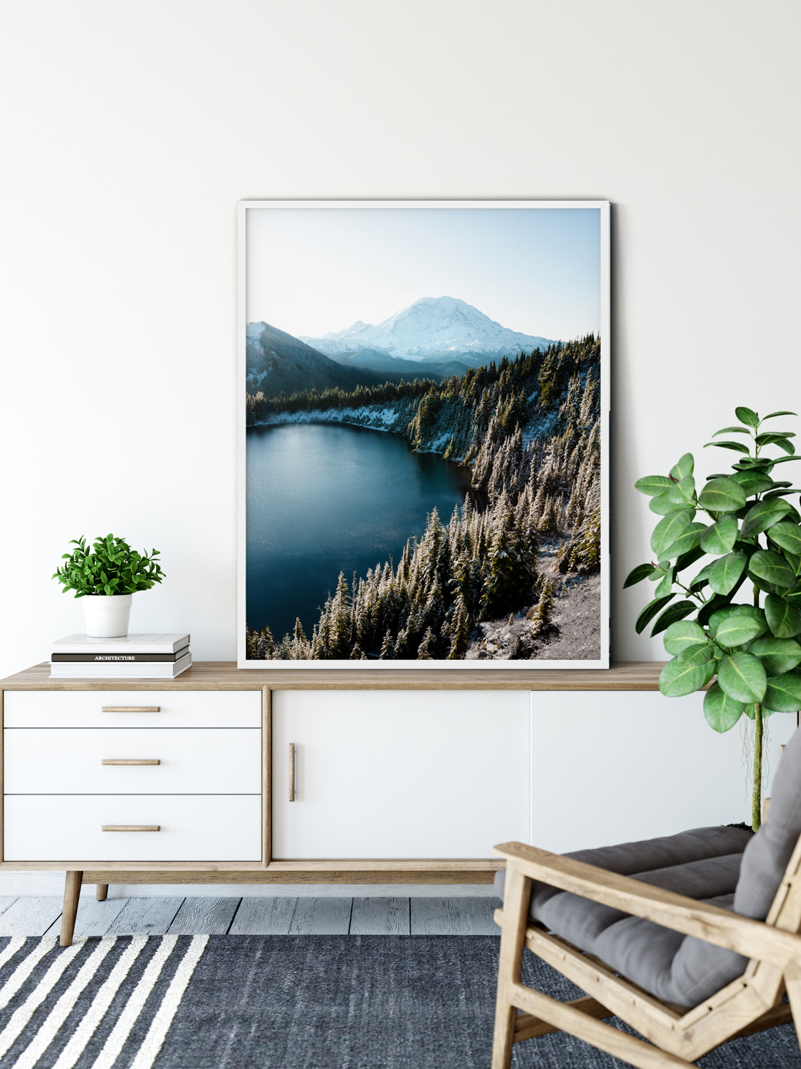 A wide shot of the snow-covered peak of Mount Rainier under a bright blue sky.