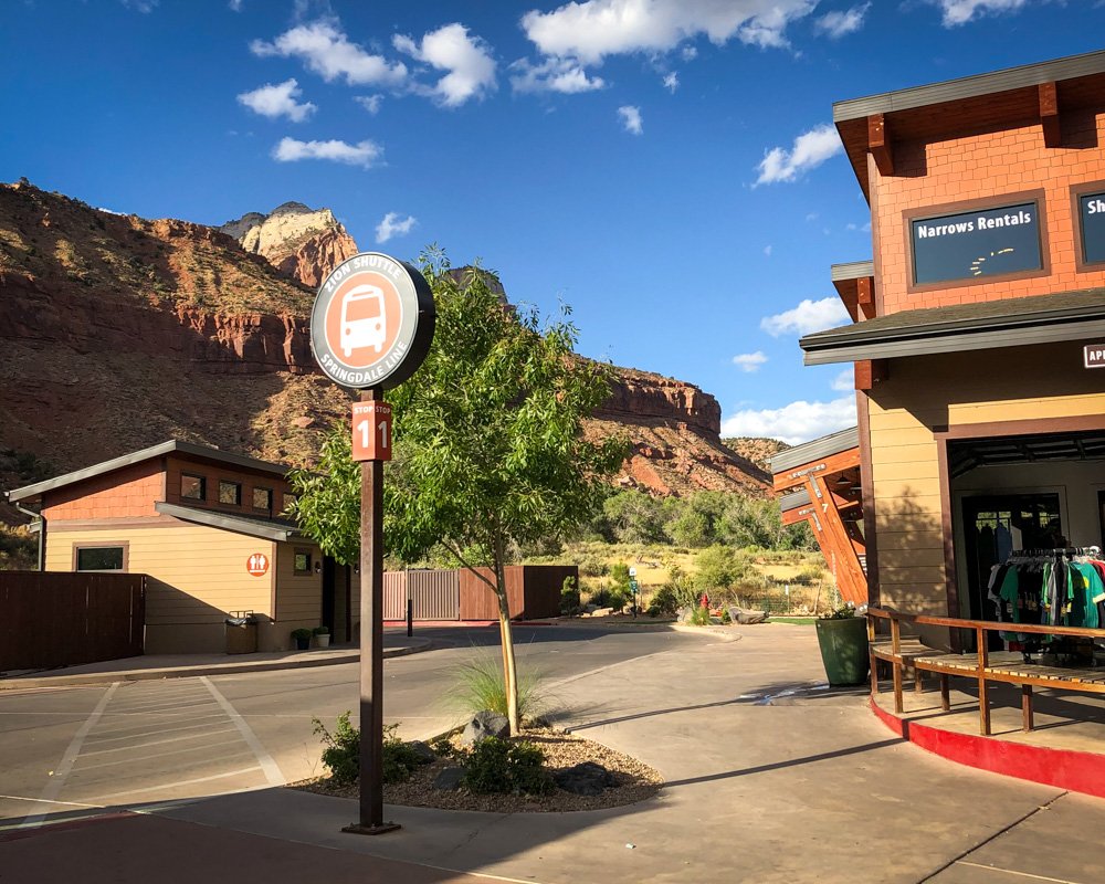 A Zion National Park shuttle bus picking up passengers on the Springdale Line.