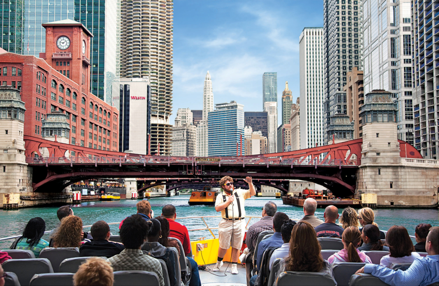 A Seadog speedboat cruising on Lake Michigan with the Chicago skyline in the background.