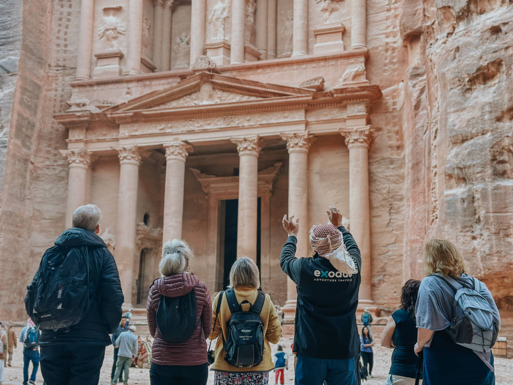 The ornate rock-cut facade of the Treasury building at the ancient city of Petra.