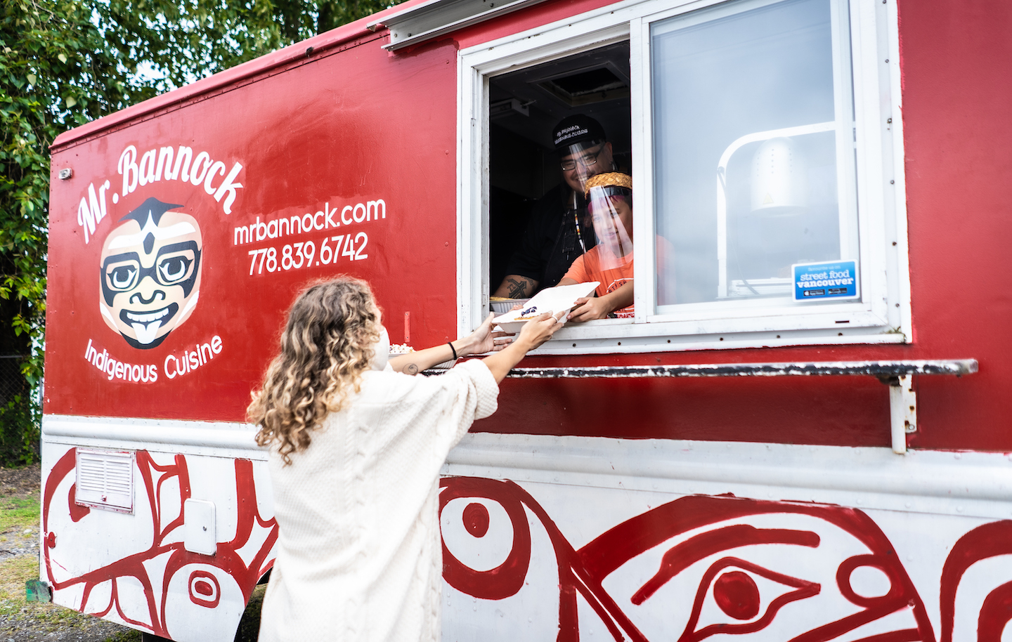 The exterior of the Mr. Bannock food truck with menus visible.