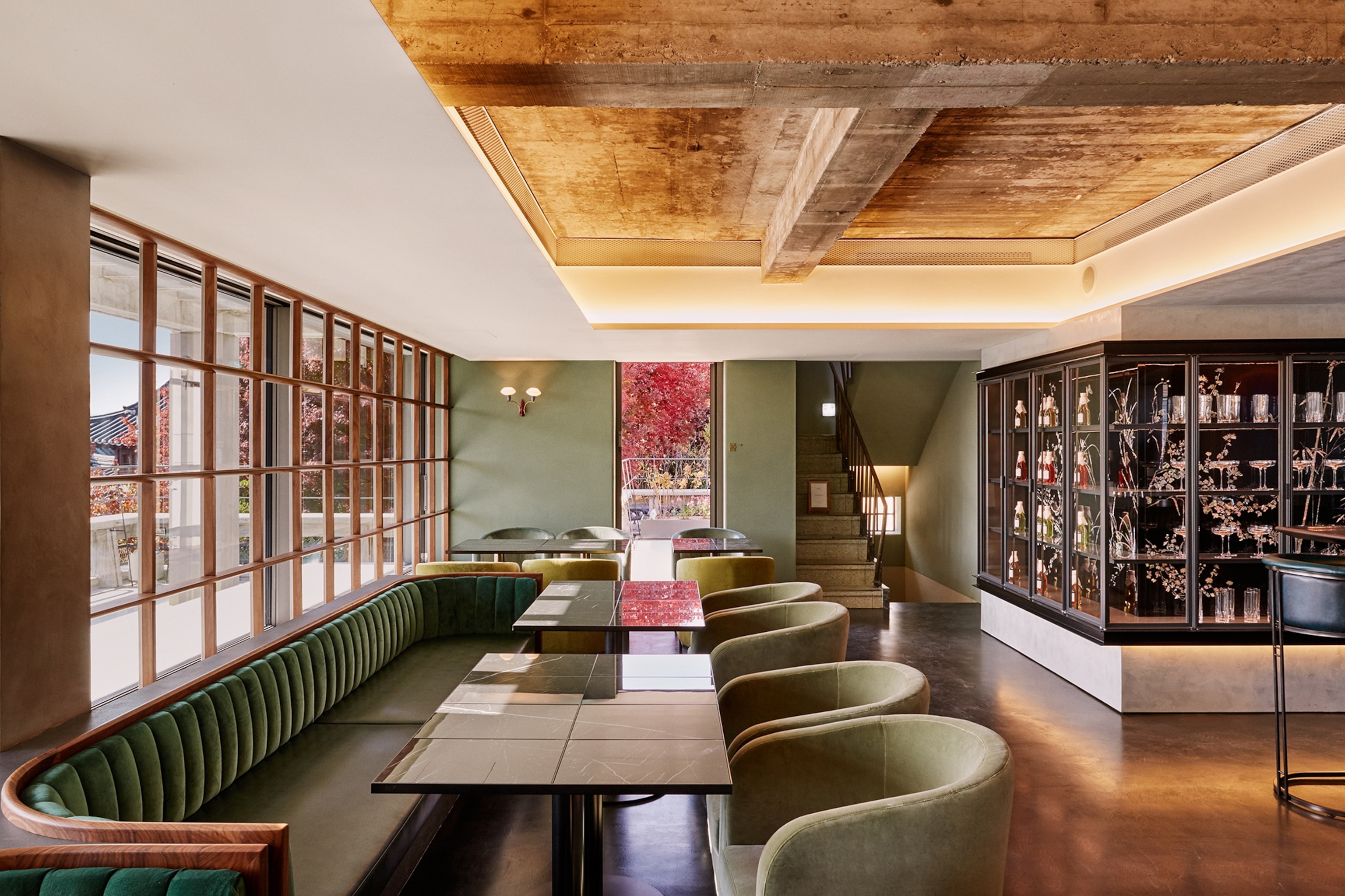The modern, sleek interior of an OSULLOC Tea House in Seoul featuring minimalist stone and wood elements.