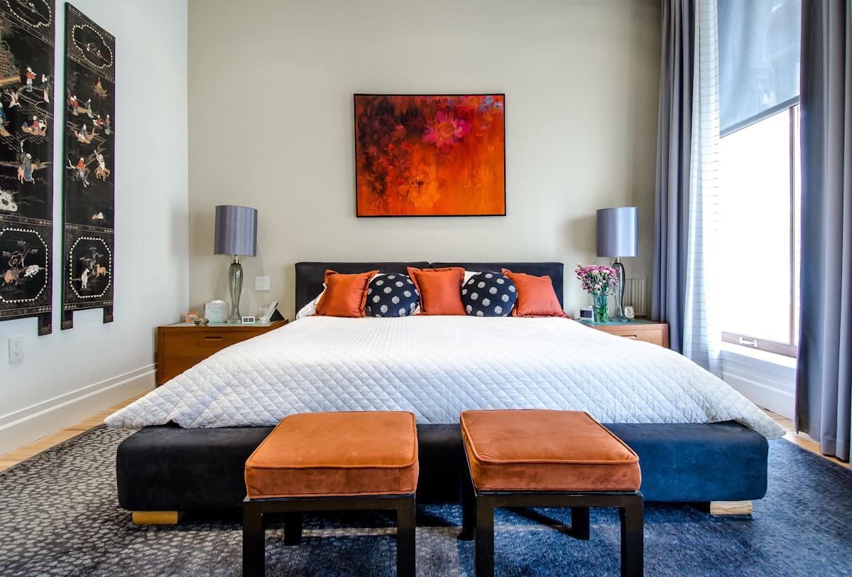 A serene luxury villa bedroom featuring high-end minimalist design and neutral tones.