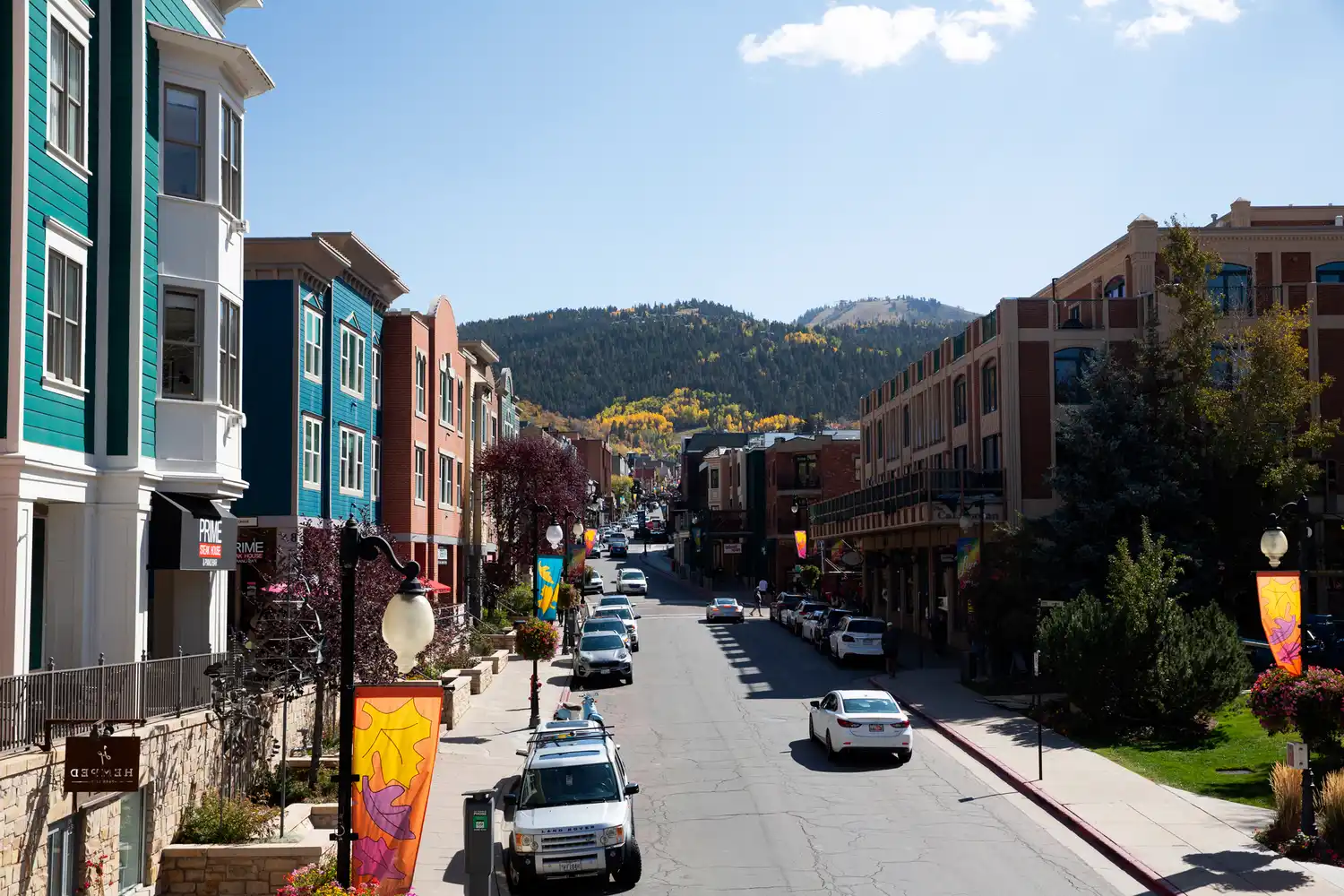 A view of downtown Park City, Utah, featuring historic buildings and a snowy hillside.