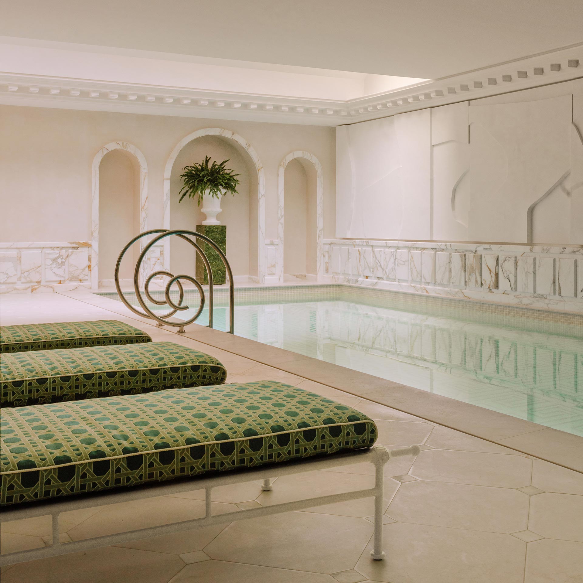 The opulent Guerlain Spa interior at Saint James Paris with ornate wall carvings.
