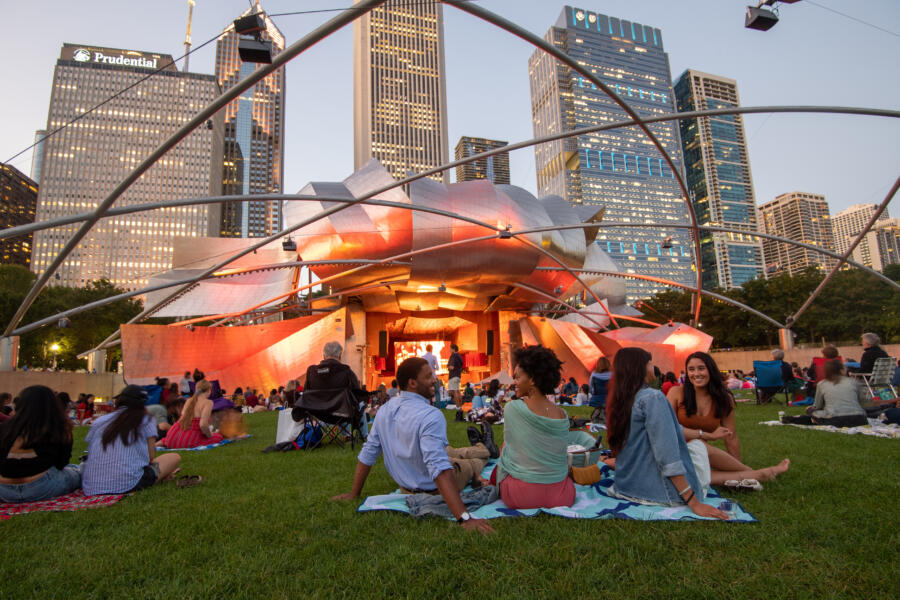 A large crowd gathered at the Jay Pritzker Pavilion for an outdoor concert.