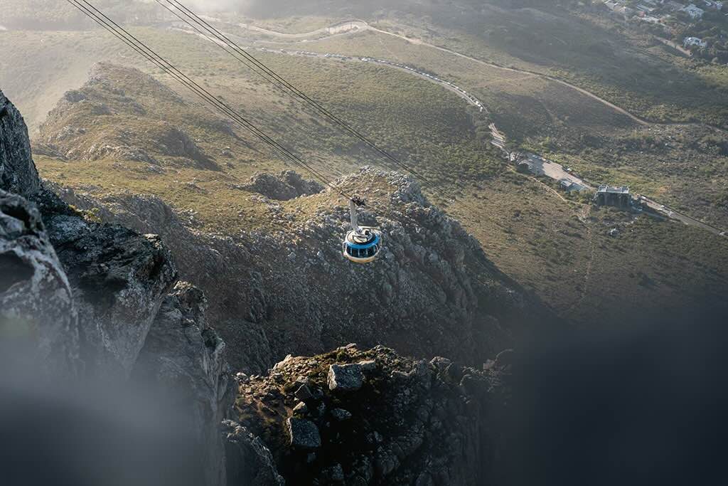 An aerial perspective of Table Mountain and the cable car overlooking Cape Town.