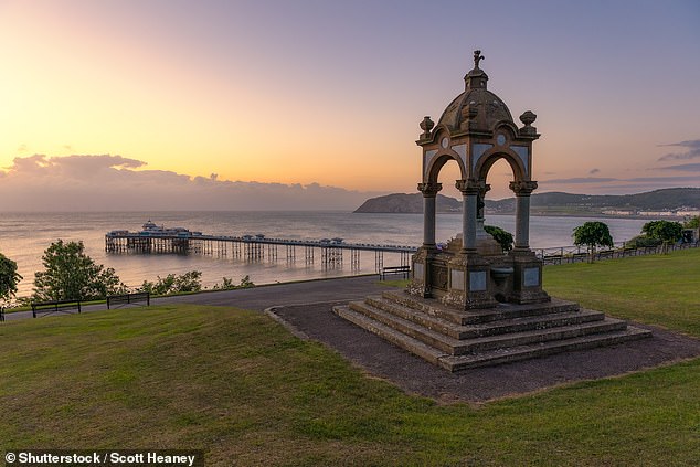 The Victorian pier and Queen Victoria Memorial in Llandudno, North Wales.