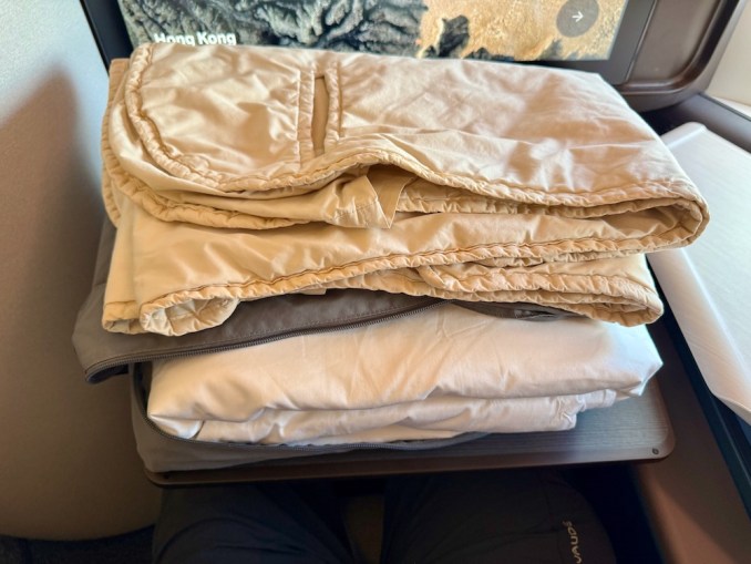 The Aria Suite seat converted into a fully flat bed with premium Bamford bedding.