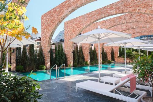 Spacious luxury hotel suite with modern architecture and an indoor pool area