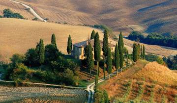 Panoramic landscape view of the rolling hills and countryside in Tuscany during autumn.