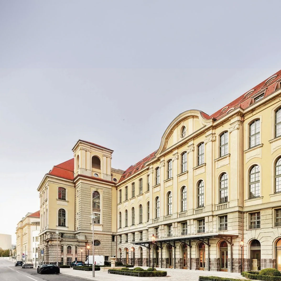 A room in the Telegraphenamt hotel showing exposed brick walls and barrel-vaulted ceilings.