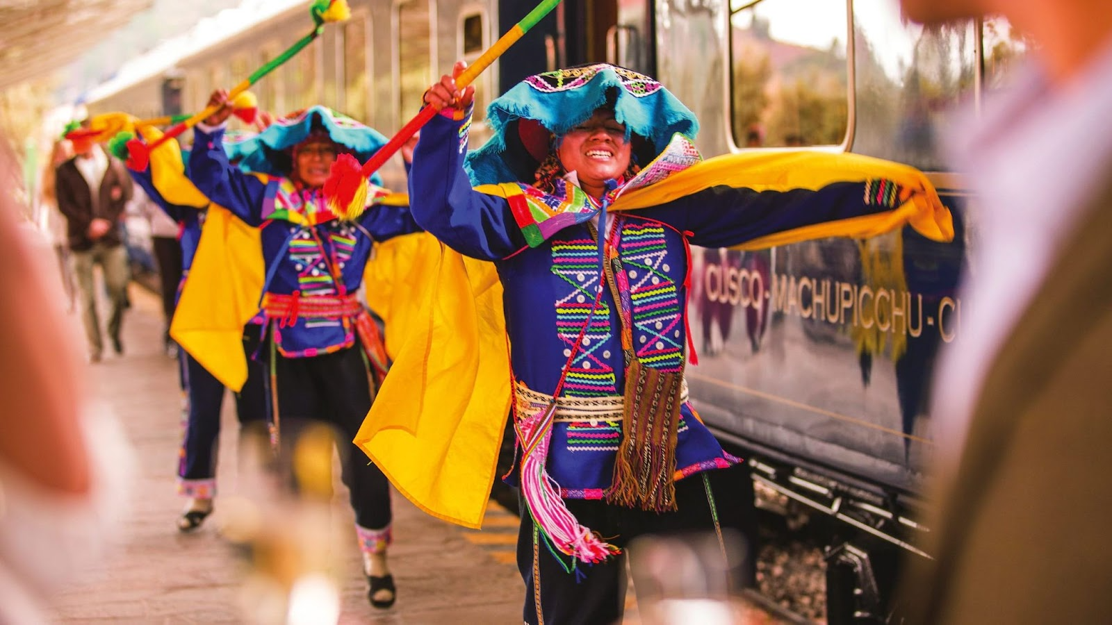 Musicians performing live traditional music inside a luxury train carriage.
