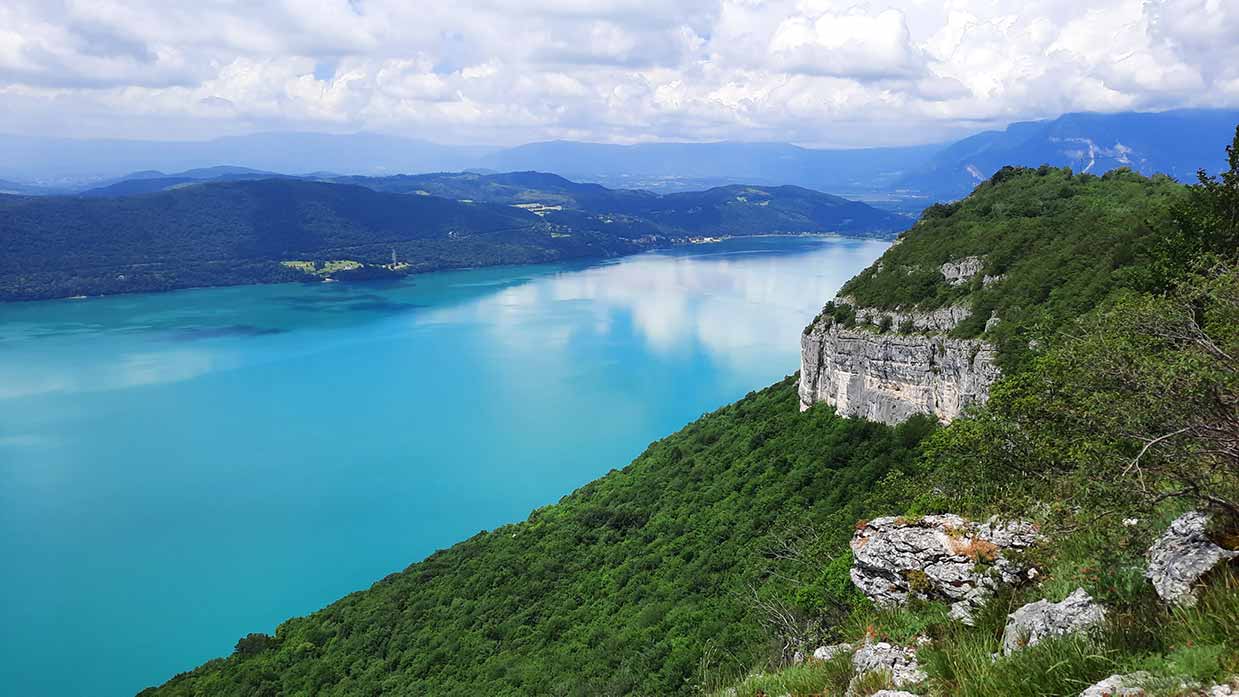 A wide view of Lac du Bourget surrounded by the French Alps.