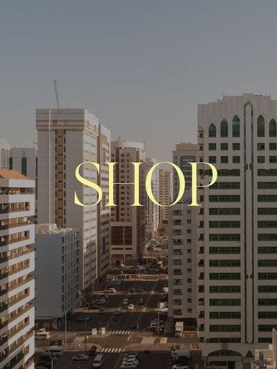 A wide view of a modern high-end retail destination in Abu Dhabi with architectural lighting.