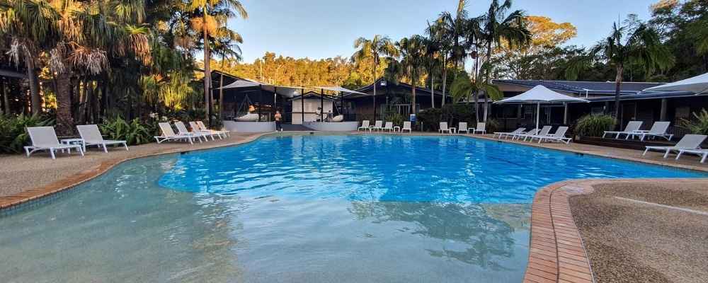 The outdoor swimming pool and lounge area at the Angourie Resort in Yamba.