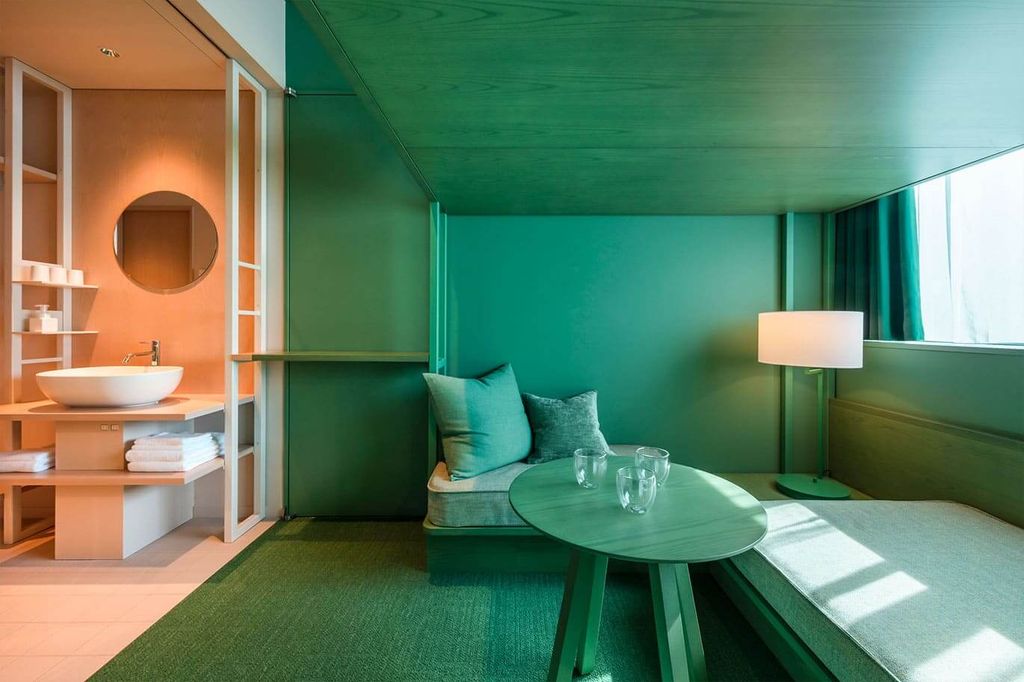 Colorful and modular room design at Toggle Hotel Suidobashi with dual-tone paint schemes.