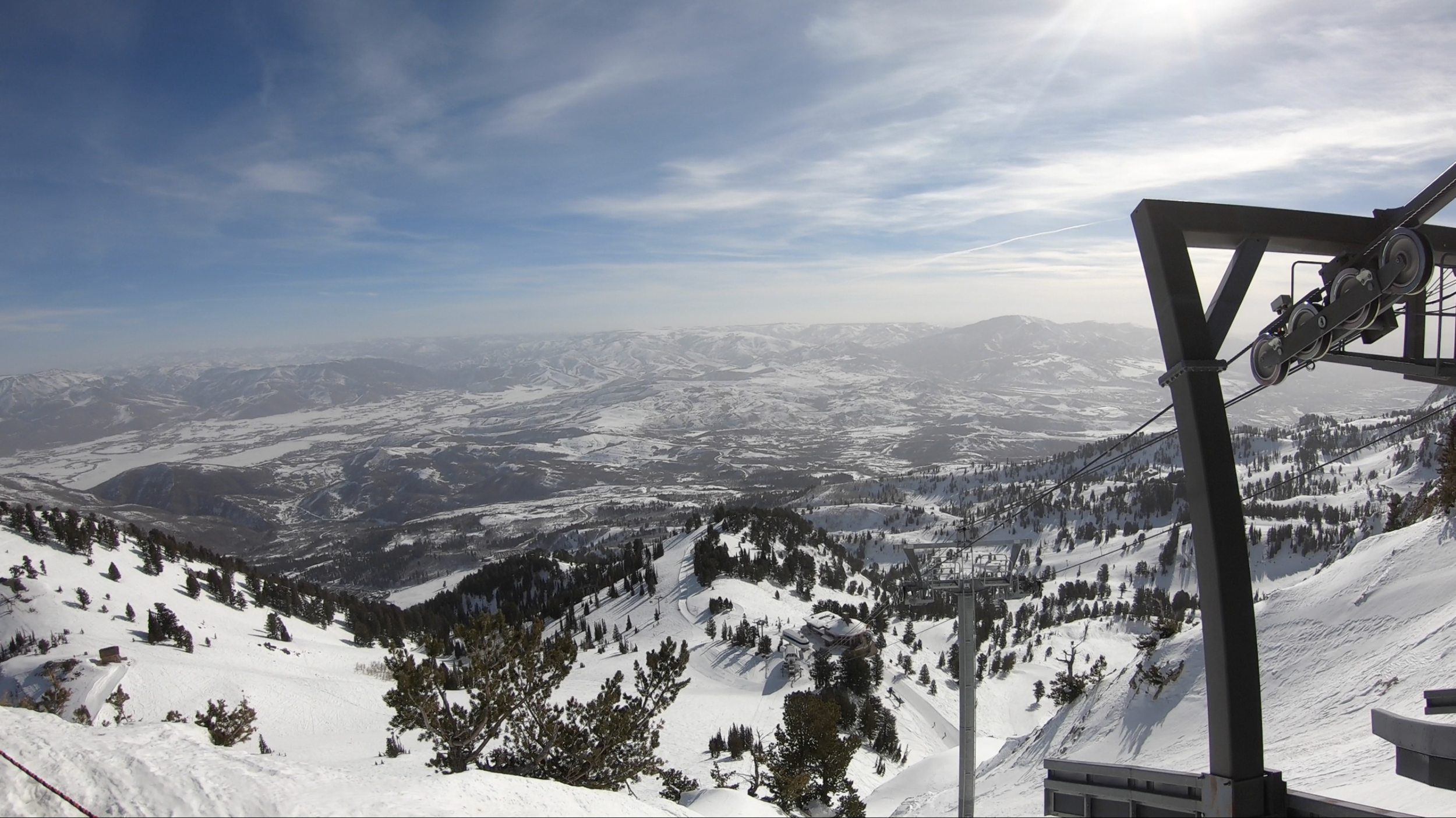 Top-tier resort facilities and sharp mountain peaks at Snowbasin, Utah.