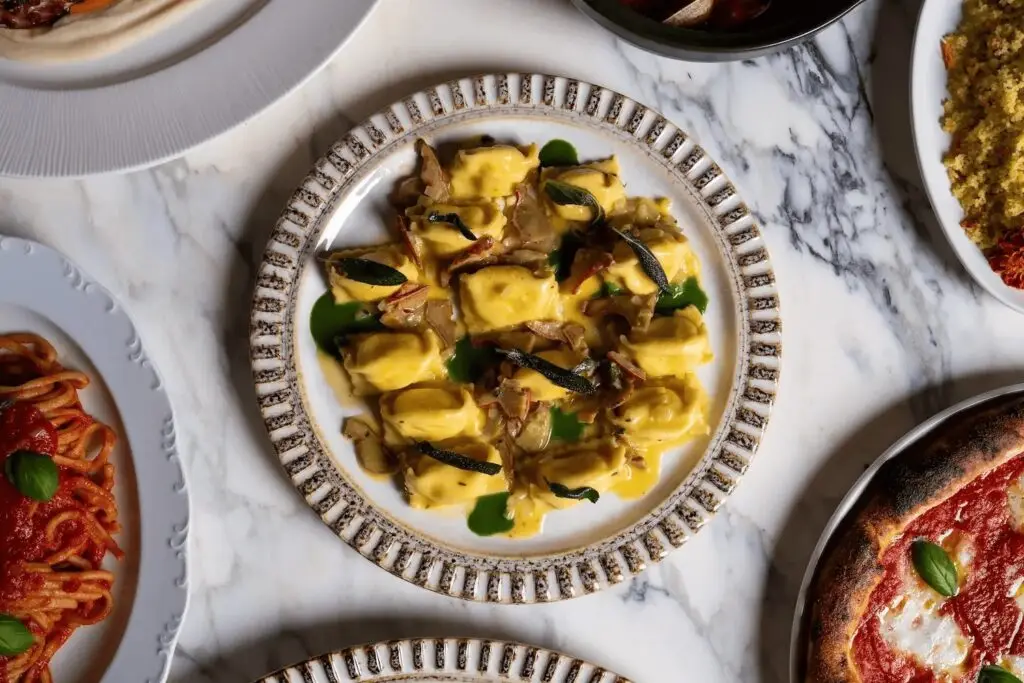 A group of people enjoying a meal at an upscale restaurant during San Diego Restaurant Week.