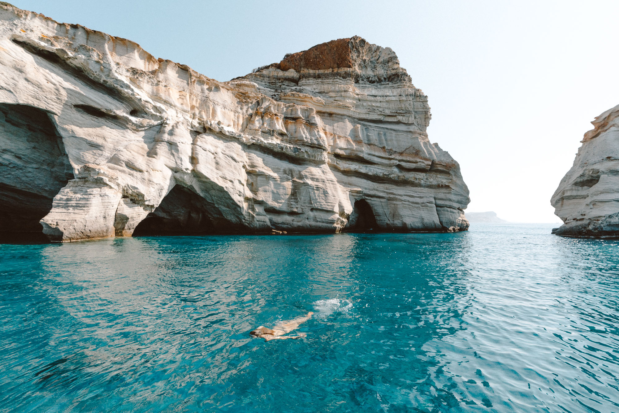Dramatic white rock arches and turquoise water at the Kleftiko sea caves.