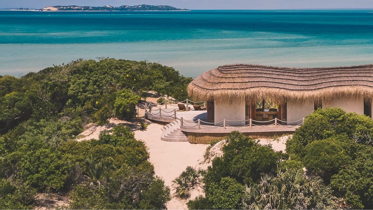 Modern thatched-roof villa exterior at Kisawa Sanctuary on the coastline.