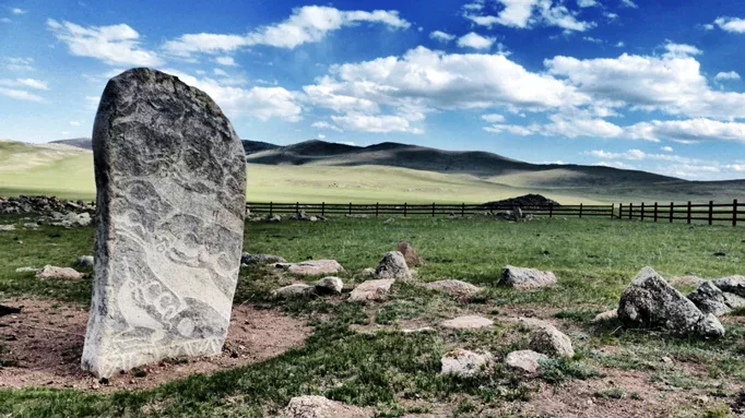 An ancient stone deer monolith standing in the Khuvsgul province wilderness.