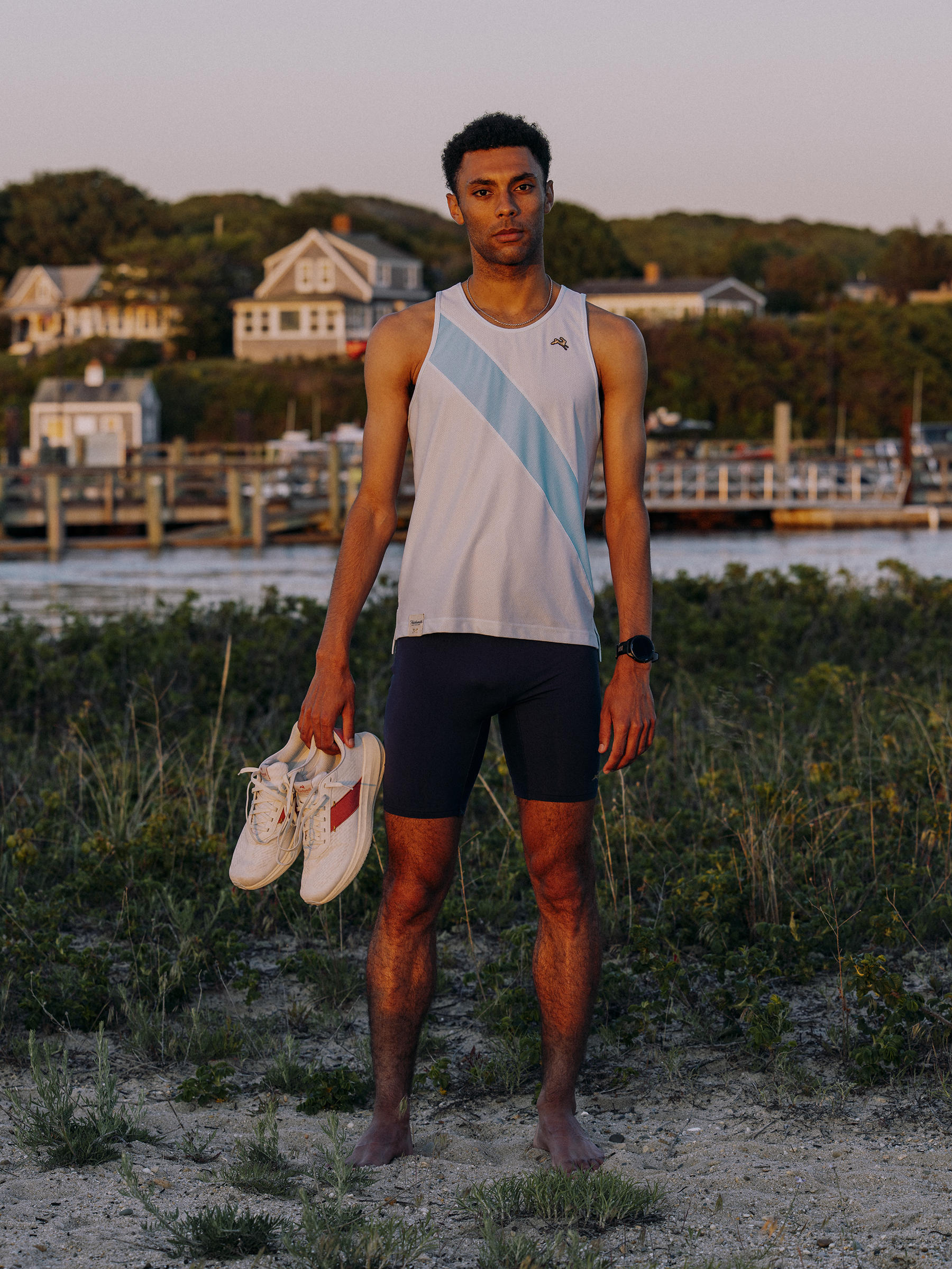 A flat-lay layout of summer training essentials for male runners.