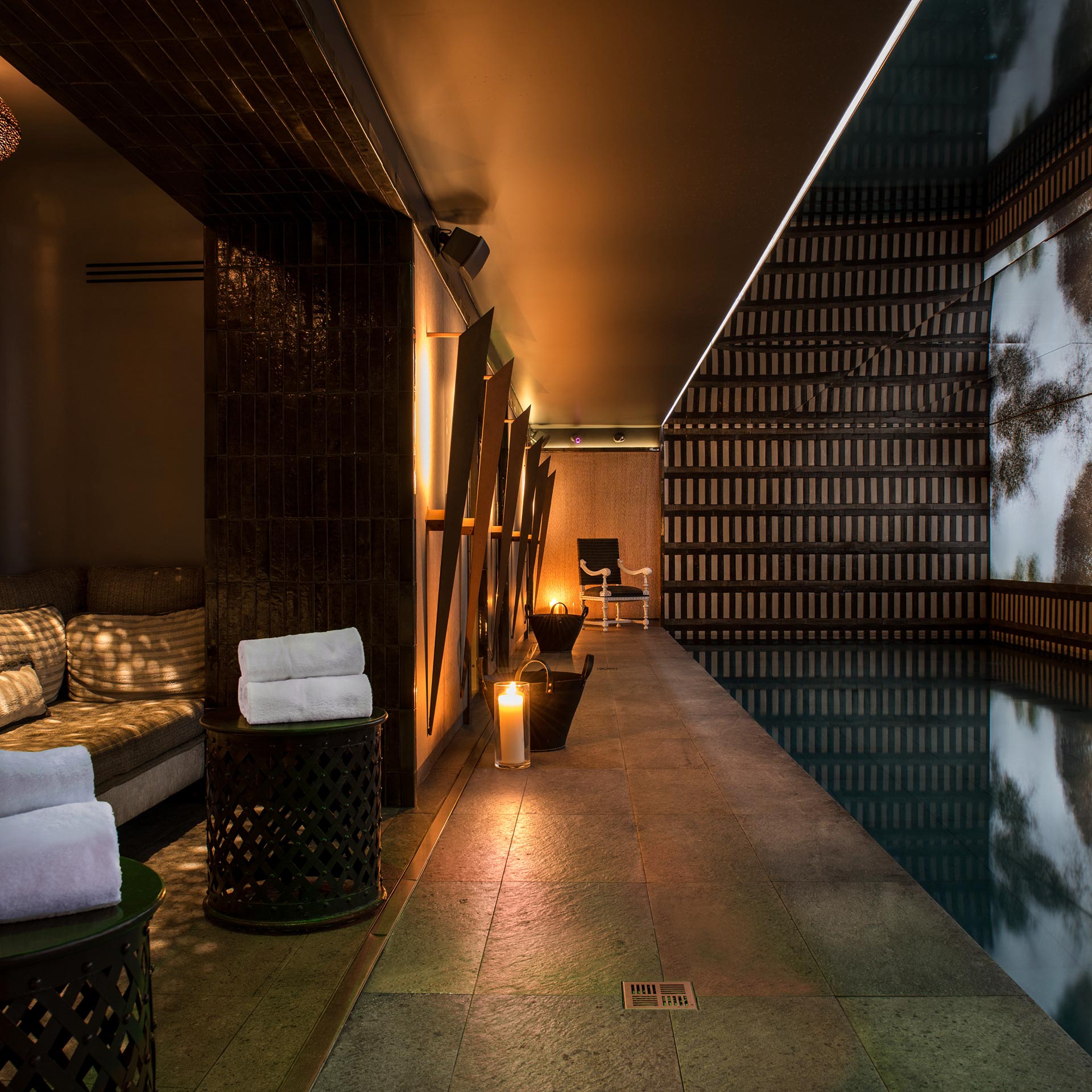 Modern granite and wood paneling in the Nolinski Paris spa area.