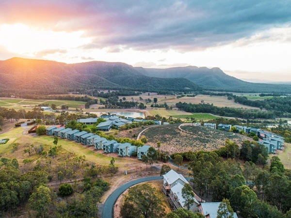 Aerial view of a luxury retreat nestled in the green hills of the Hunter Valley.