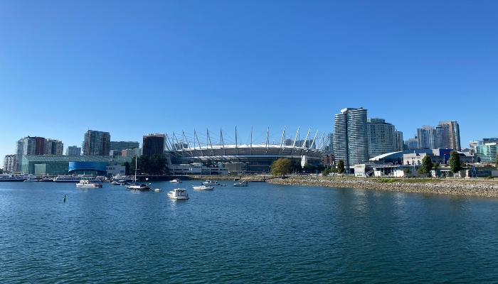 Exterior view of the BC Place stadium with its iconic white roof structure in downtown Vancouver.