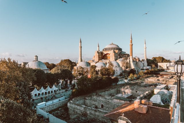 The Blue Mosque in Istanbul with its domes and minarets covered in a light layer of snow.