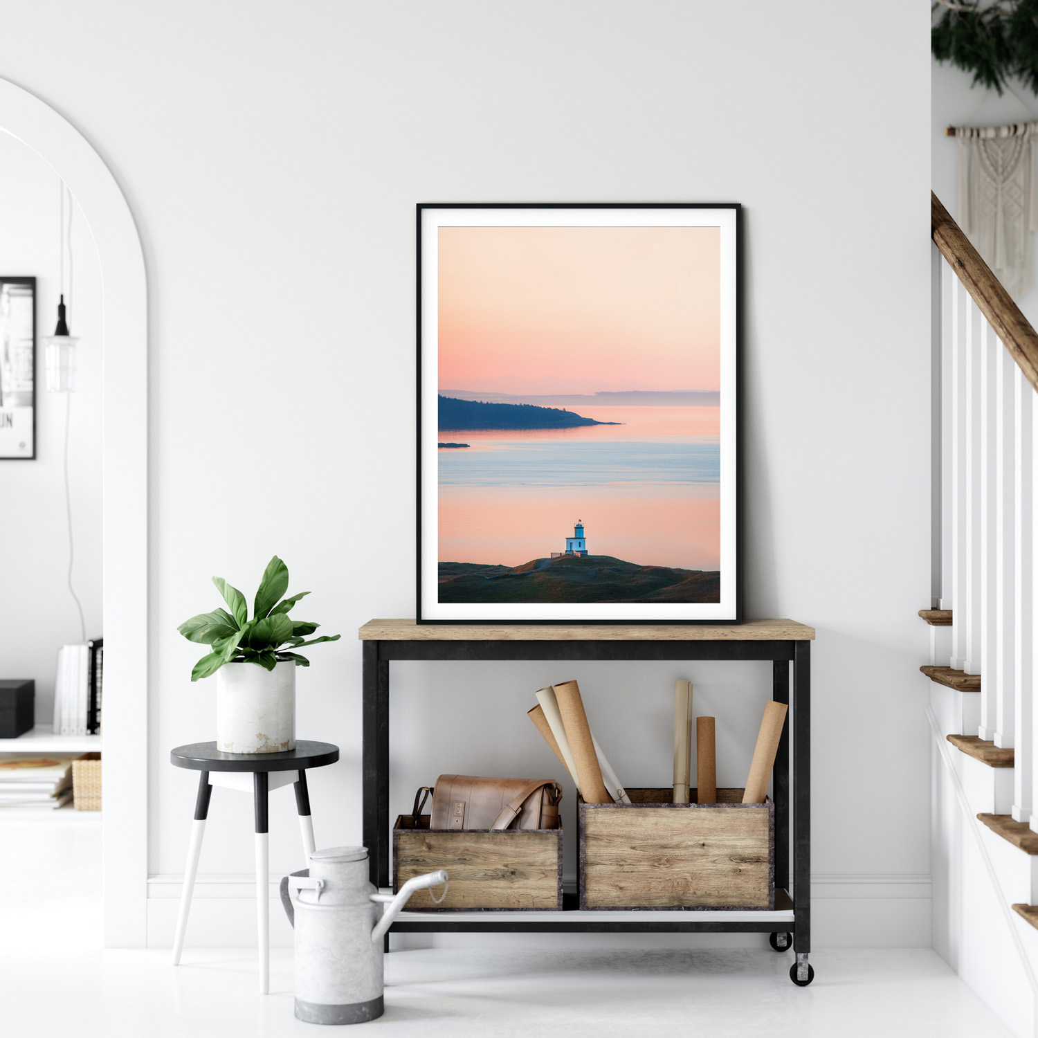 The historic West Point Lighthouse sitting on a sandy beach at the base of a cliff in Discovery Park.