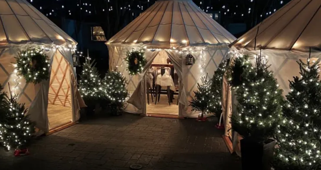 Heated yurts with vintage interior decor and warm lighting at a Boston bar.