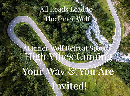 A wide view of a lush green property with mountain peaks in the background near Asheville.