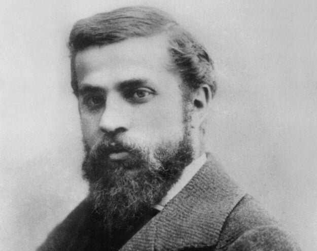 Black and white historical portrait of architect Antoni Gaudí.