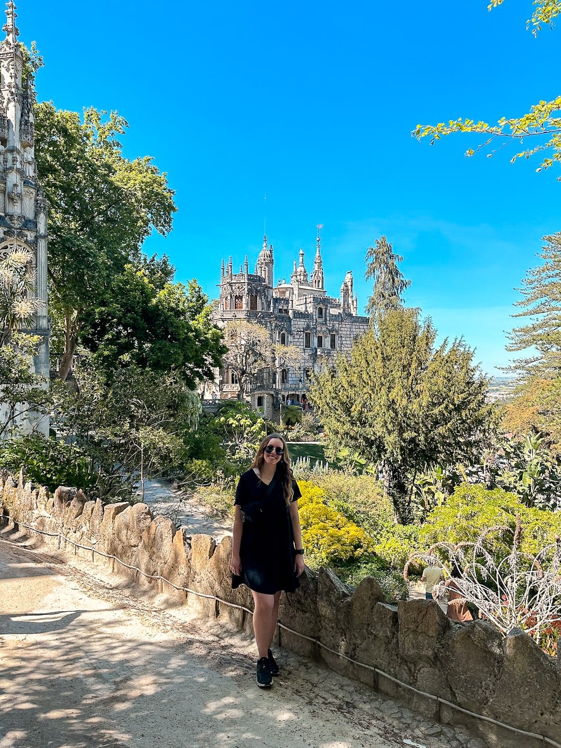 The colorful Pena Palace in Sintra surrounded by lush greenery.