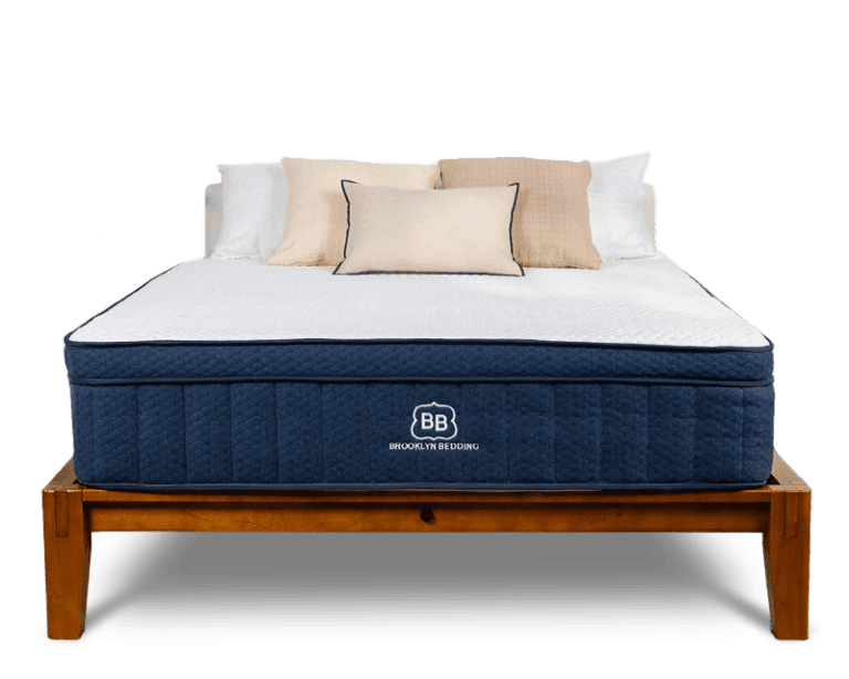 A luxury hybrid cooling mattress styled in a modern home bedroom.