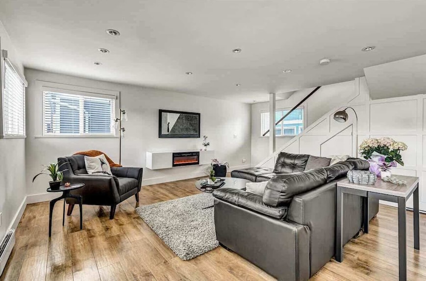 A modern floating home houseboat with large windows located at Lonsdale Quay.