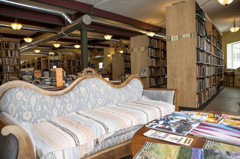 Densely packed shelves of rare and used books inside Liberty Rock Books.