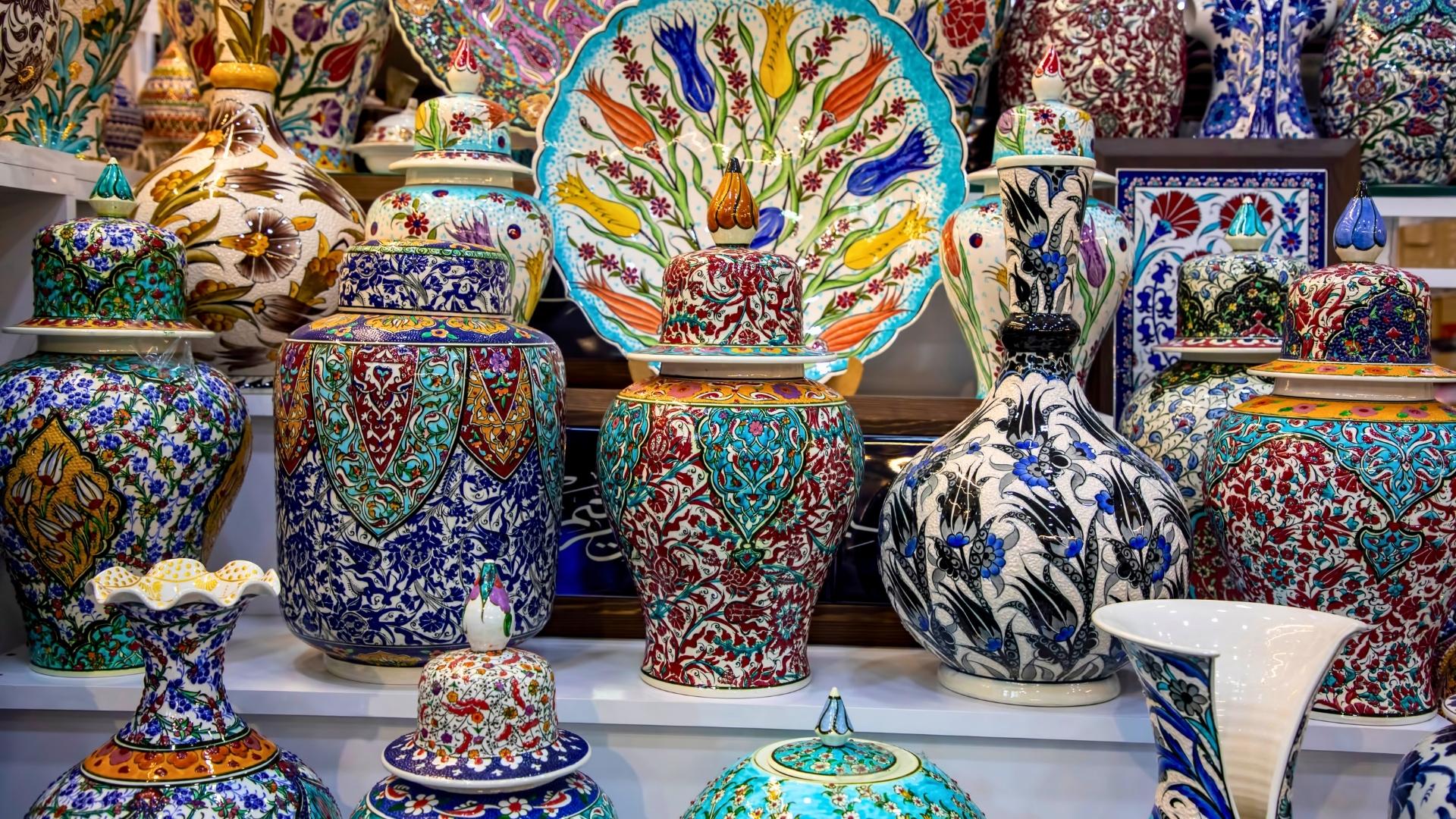 A display of traditional blue and white Iznik ceramic tiles and pottery.