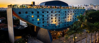 The iconic crescent-shaped architecture of Hotel Unique in São Paulo.