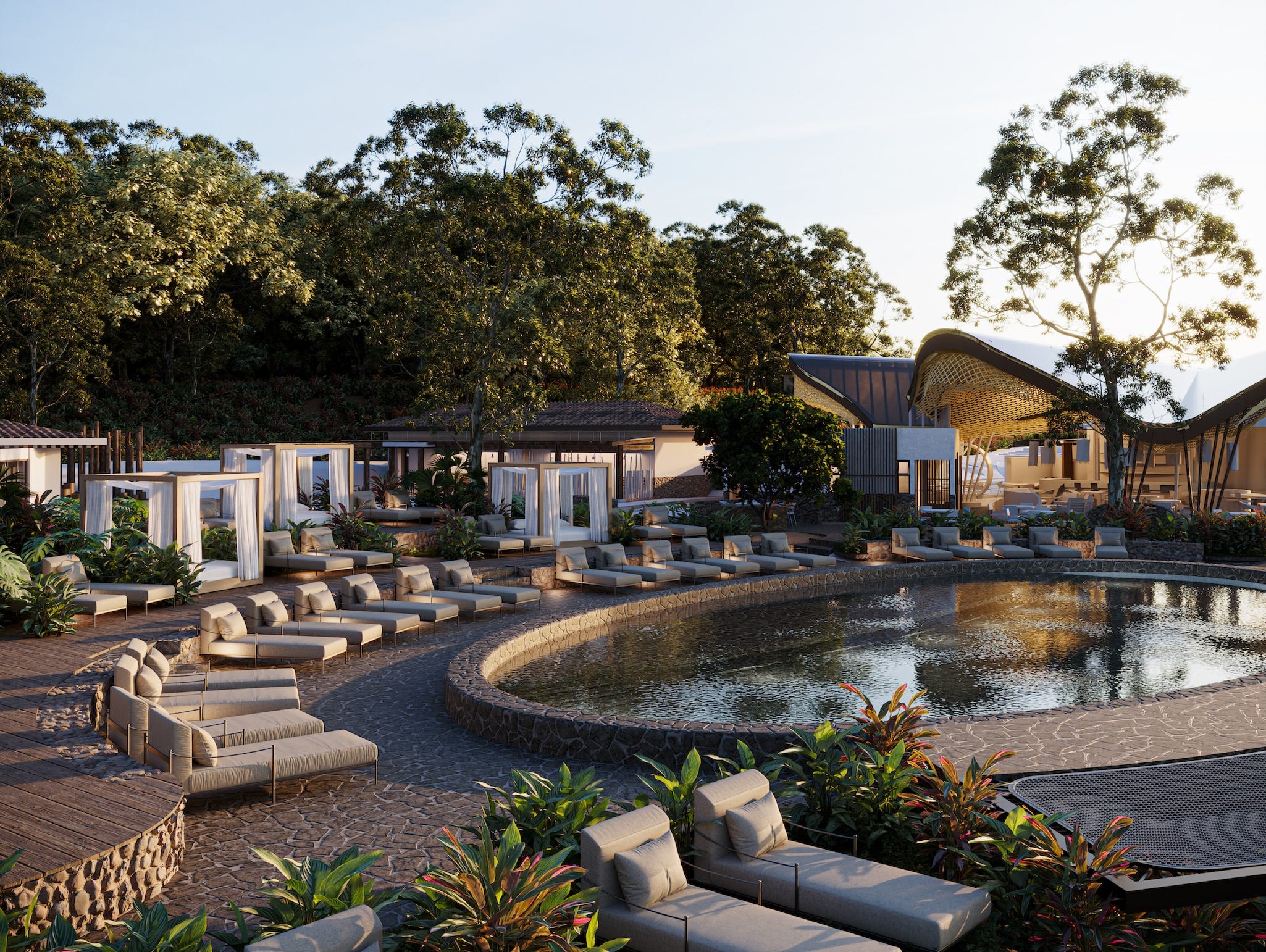 A luxury pool surrounded by dense tropical jungle foliage.