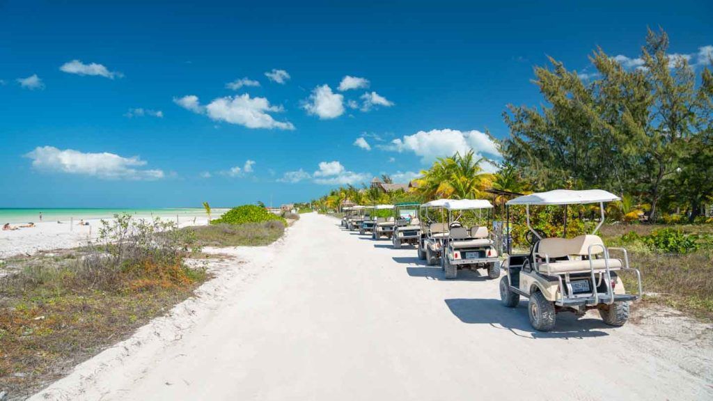 Crystal clear turquoise water meeting the white sand shore at Isla Holbox.