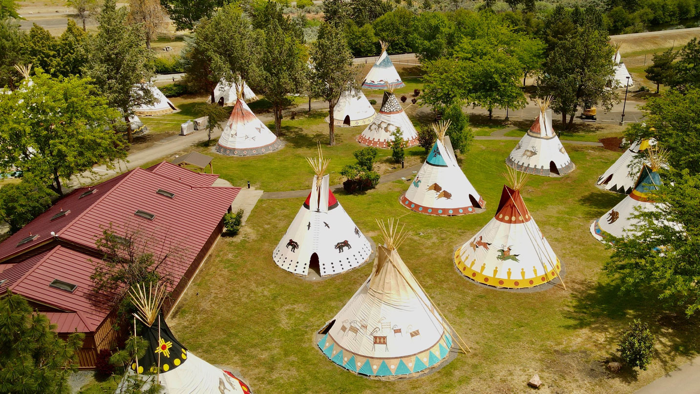 Traditional teepee structures at an Oregon outdoor exhibit or resort.