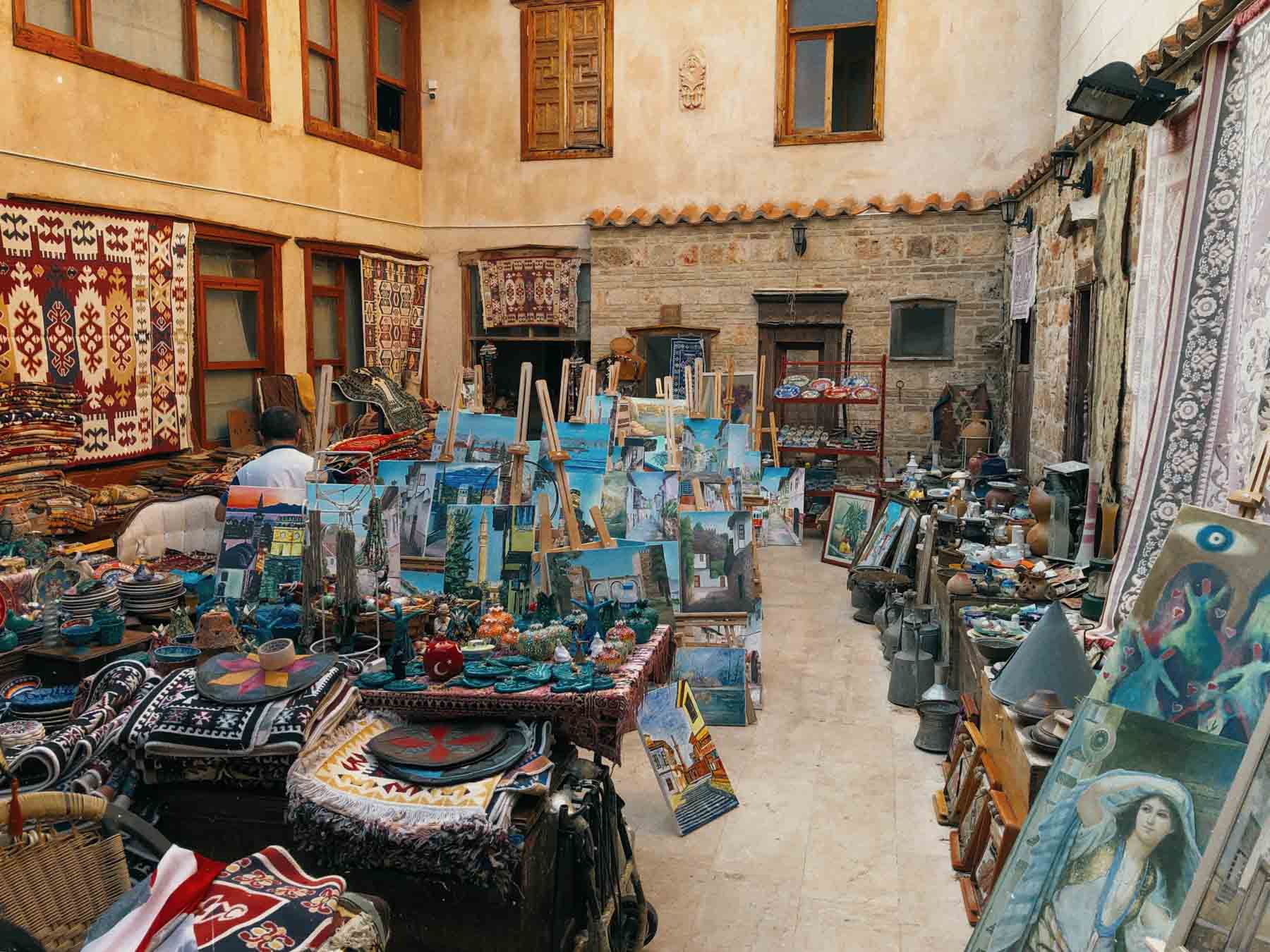 The Old Marina in Antalya with historic stone buildings and docked boats in the harbor.
