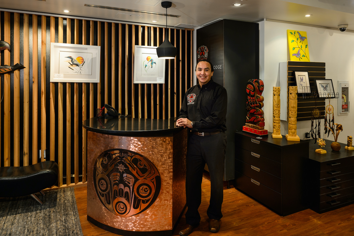 The interior gallery space of Skwachays Lodge featuring various Indigenous artworks.