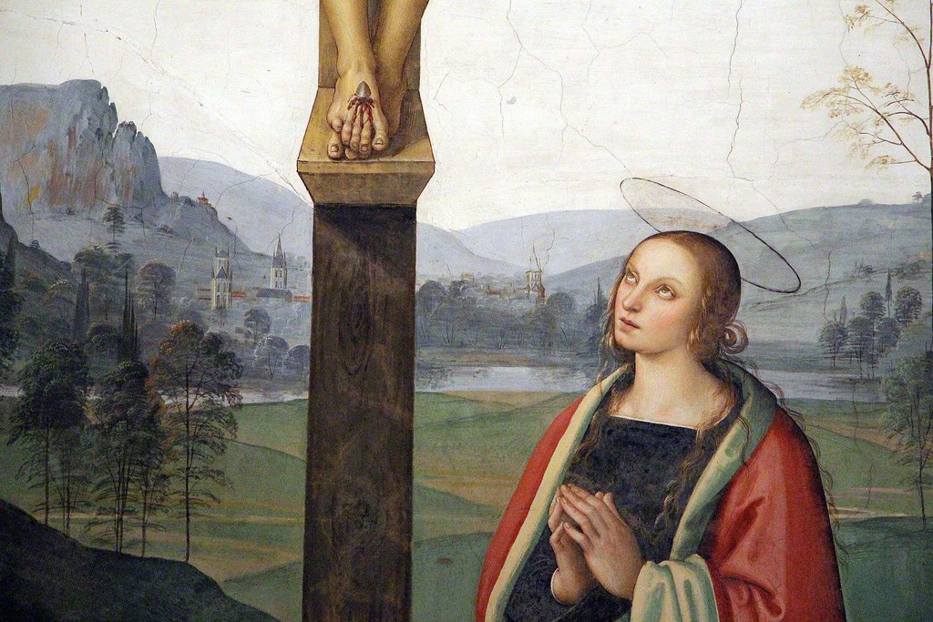 Ornate Renaissance frescoes on the ceiling of a grand hall in Florence.